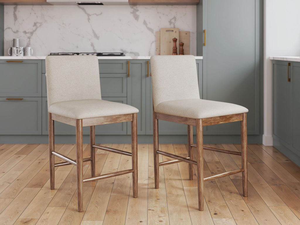 Pair of upholstered barstools with light beige seats, wood frames, metal footrest