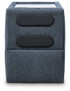 Ink blue fabric console with two black speaker grilles on front panel