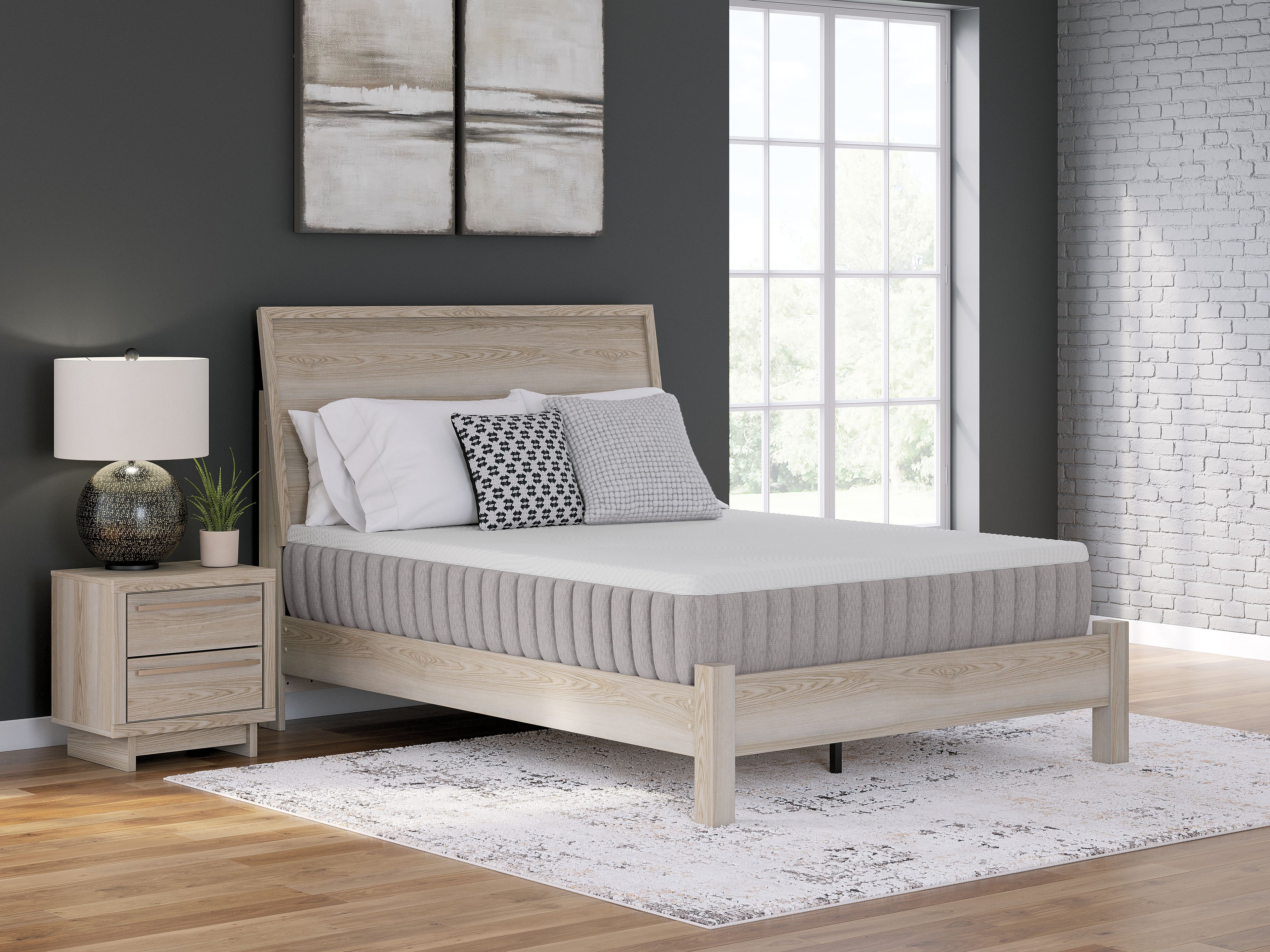 Medium mattress with quilted white top and gray vertical side panels
