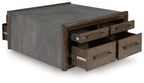 Square cocktail table with gray body and multiple brown drawers pulled out