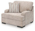 Taupe upholstered chair and a half with striped accent pillow, squared arms, dark legs
