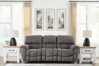 Gray power recline sofa with adjustable headrests and tufted cushions, front view