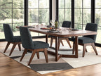 Dining table set in dark brown with four dark gray upholstered chairs and rug