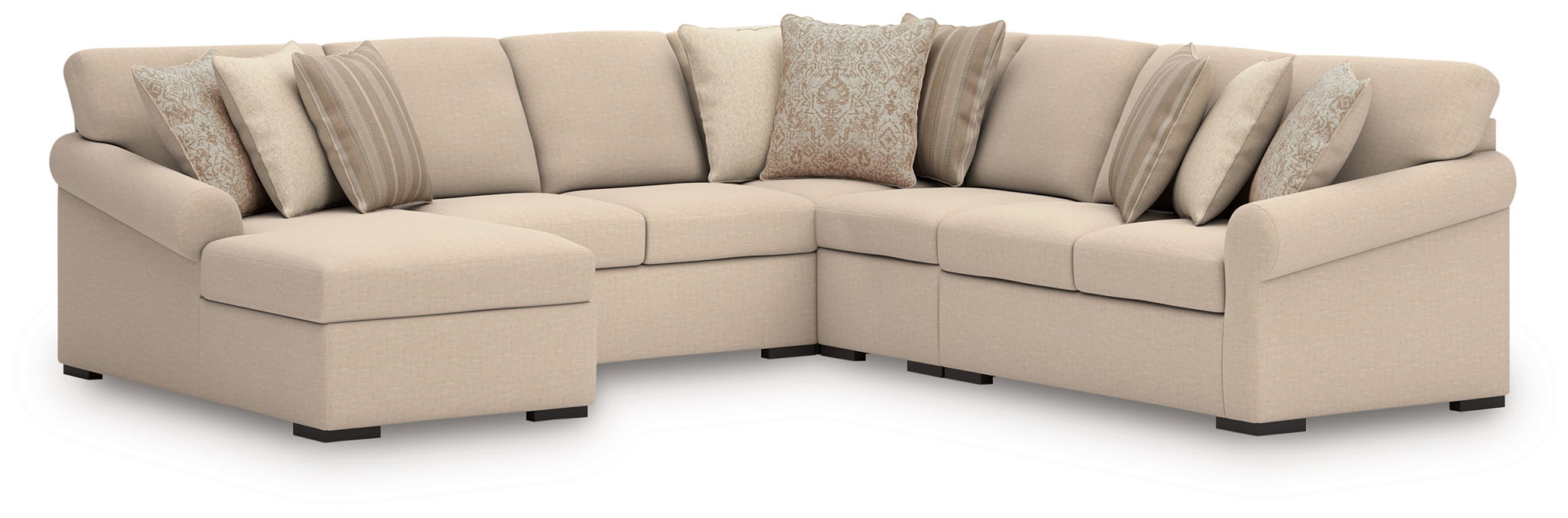 Upholstered corner sectional chaise with cream upholstery and three accent pillows