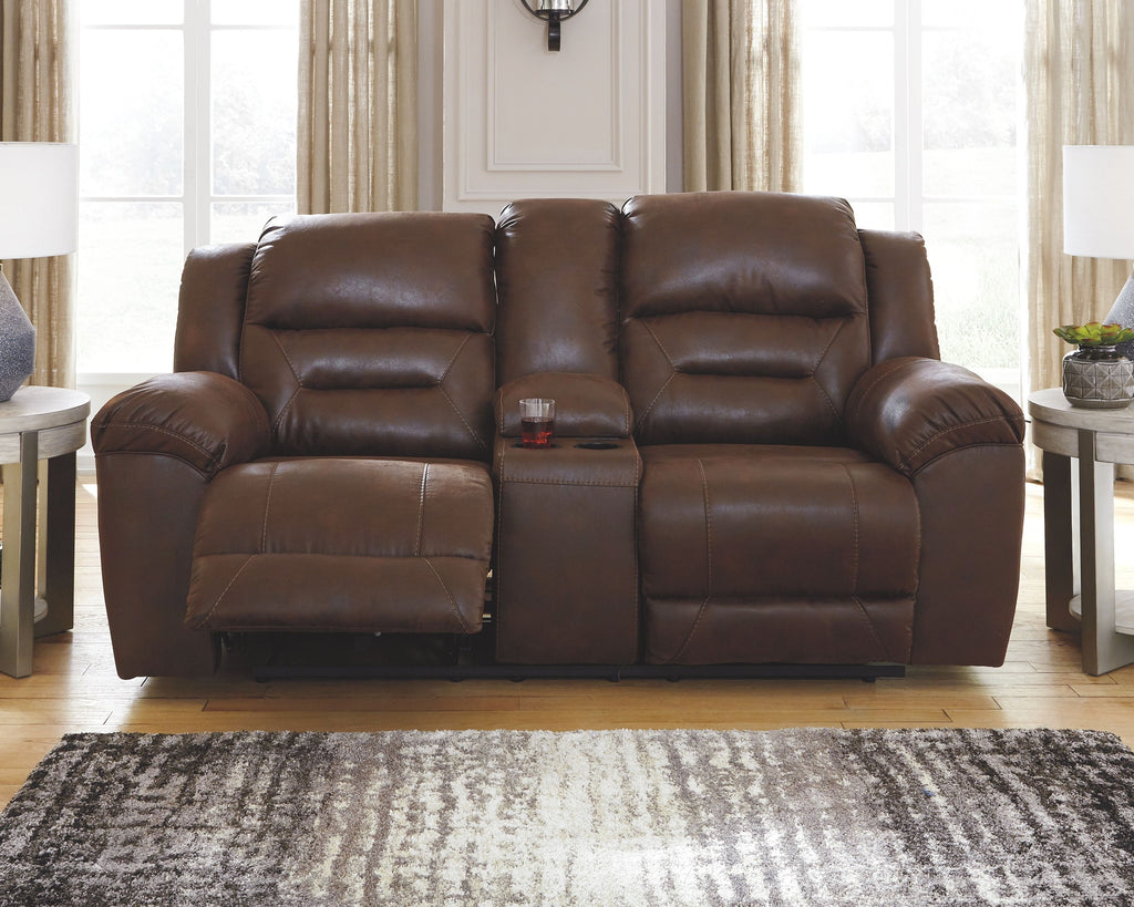 Brown reclining sofa with padded armrests and split back cushions