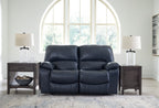 Power reclining loveseat, dark blue faux leather with cushioned back and padded arms