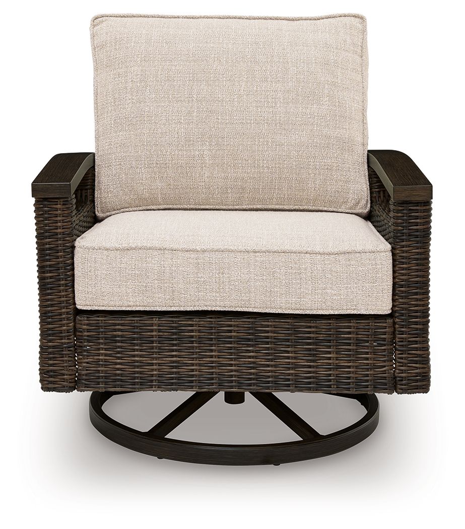 Swivel lounge chair with dark brown woven wicker frame and light beige padded back and seat