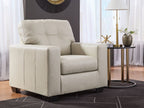 Beige upholstered accent chair with square arms and tufted back, side view