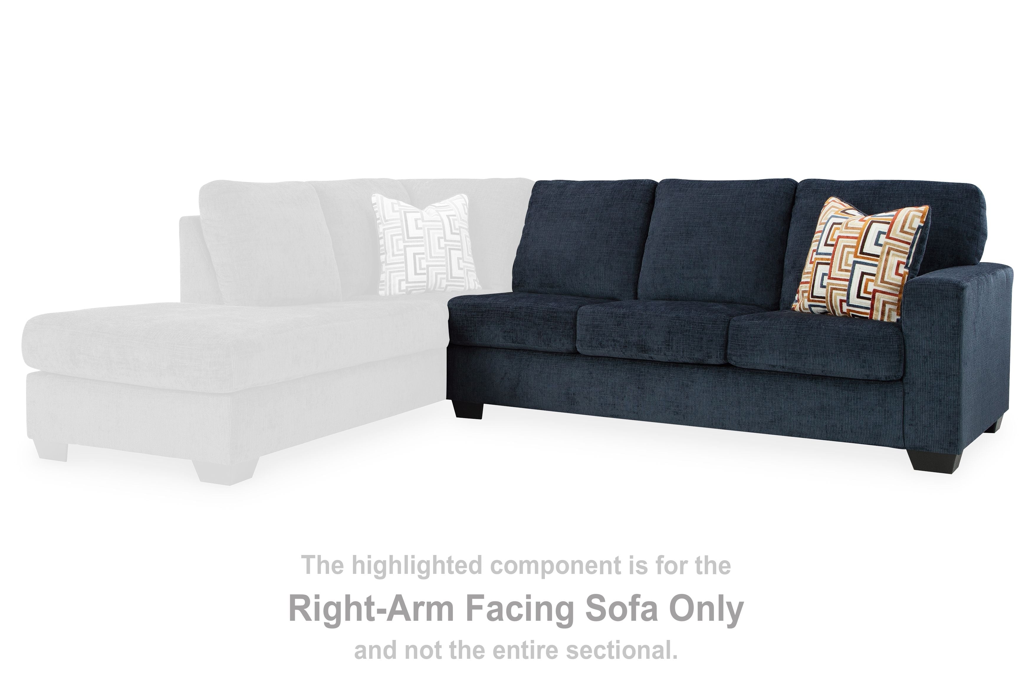 Right-arm facing ink blue sofa section with patterned pillow beside a white section
