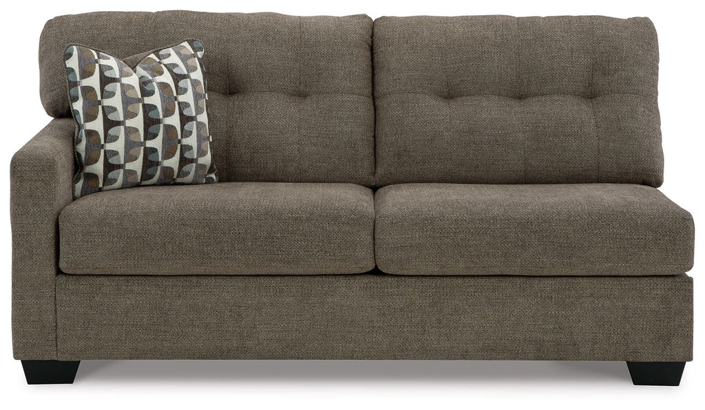 Chocolate-brown fabric full sofa sleeper with tufted arms and patterned pillow