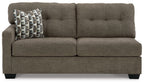 Chocolate-brown fabric full sofa sleeper with tufted arms and patterned pillow