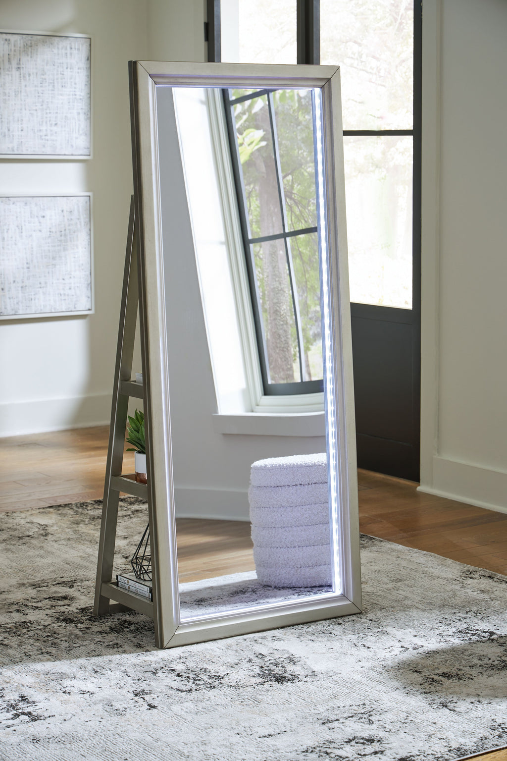 Champagne standing mirror with A-frame legs and full-length reflective panel.