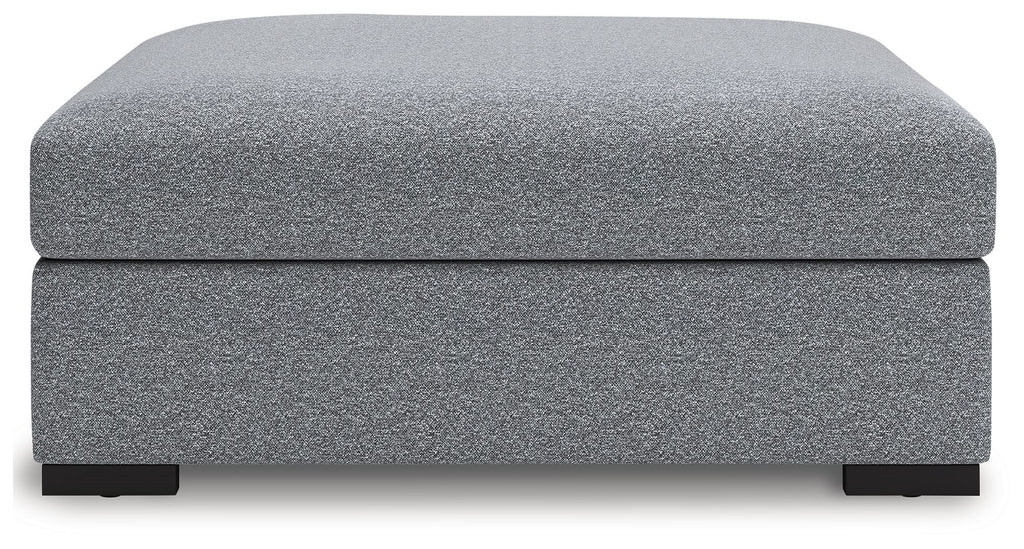 Oversized accent ottoman in salt-and-pepper upholstery, rounded top, short block legs
