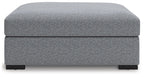 Oversized accent ottoman in salt-and-pepper upholstery, rounded top, short block legs