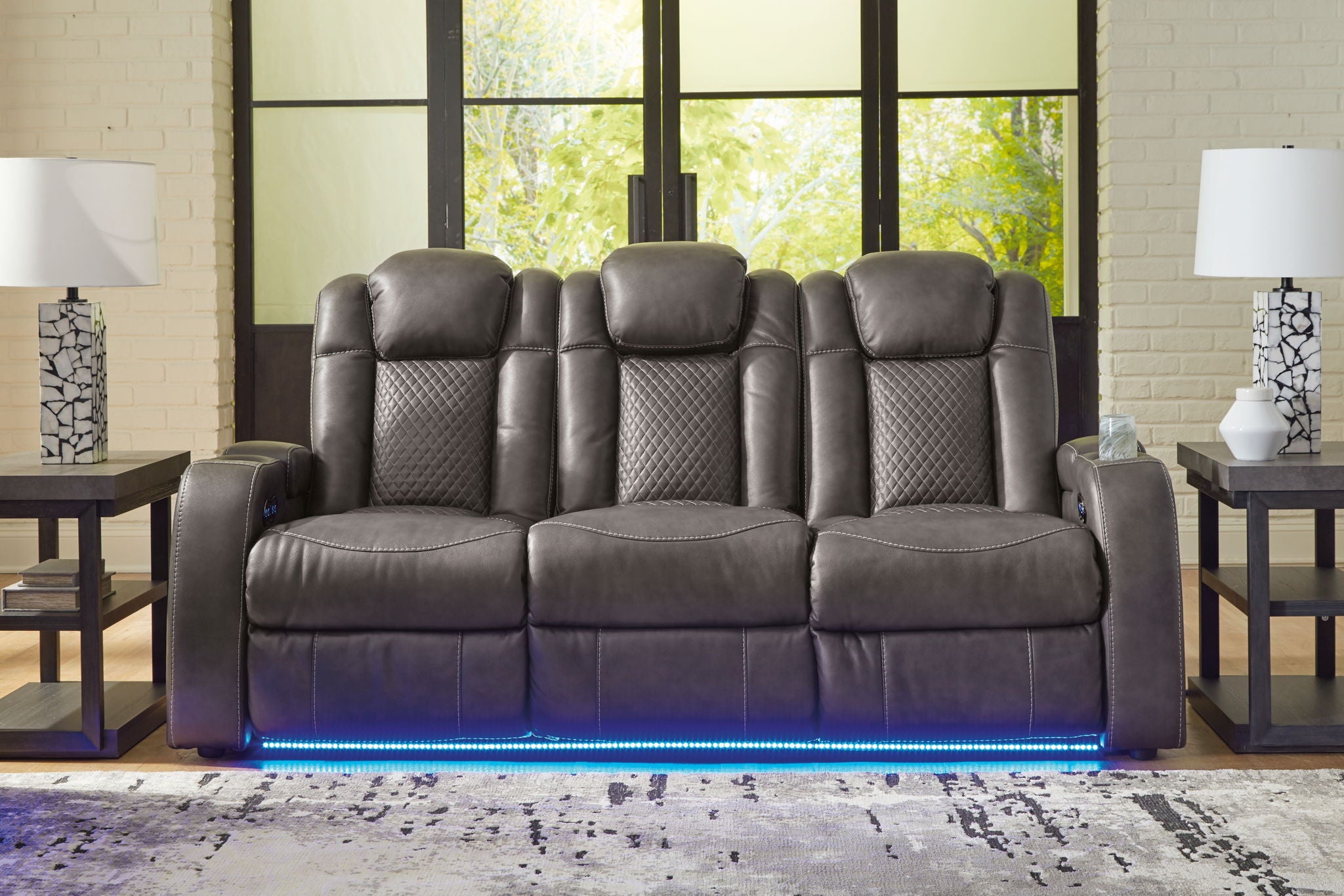 Dark gray reclining living room set recliner sofa with tufted back and blue-lit base