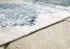 Blue and ivory area rug corner closeup with textured short pile