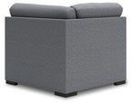 Upholstered wedge armchair with gray fabric and block legs