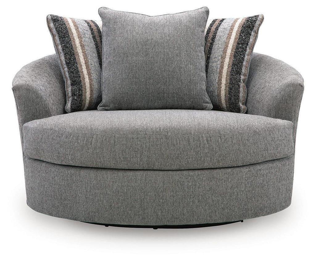 Gray oversized swivel accent chair with central back cushion and striped side pillows