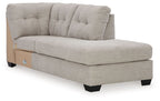 Light gray corner chaise with tufted back and track arms