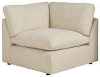 Linen wedge armchair in light beige with rounded arms and back cushions