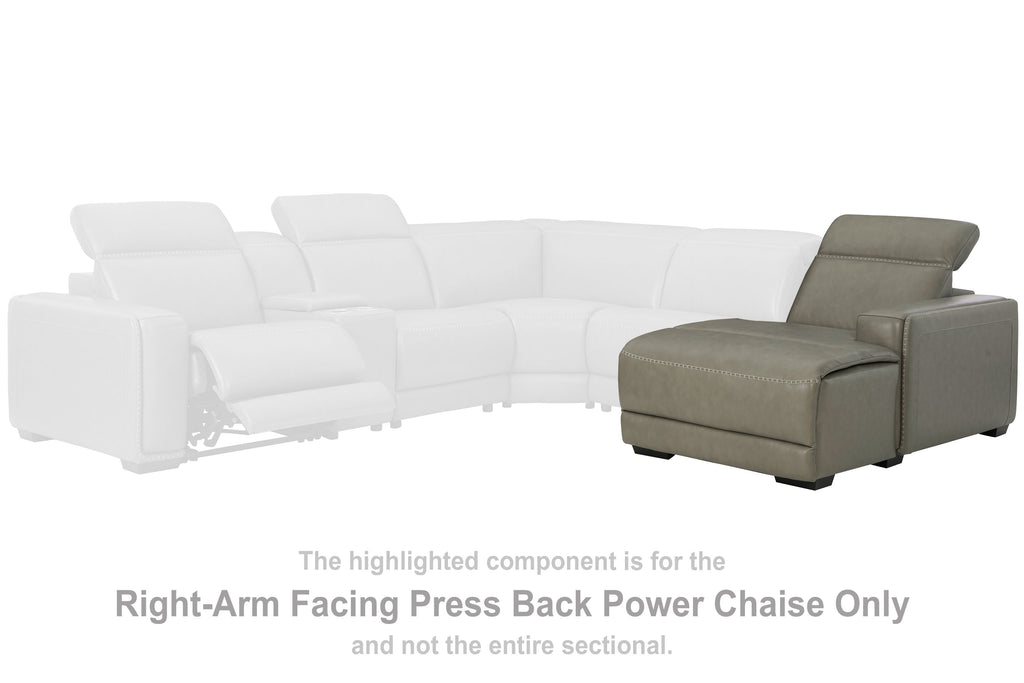 Gray power chaise with padded arms and reclined back beside white sectional