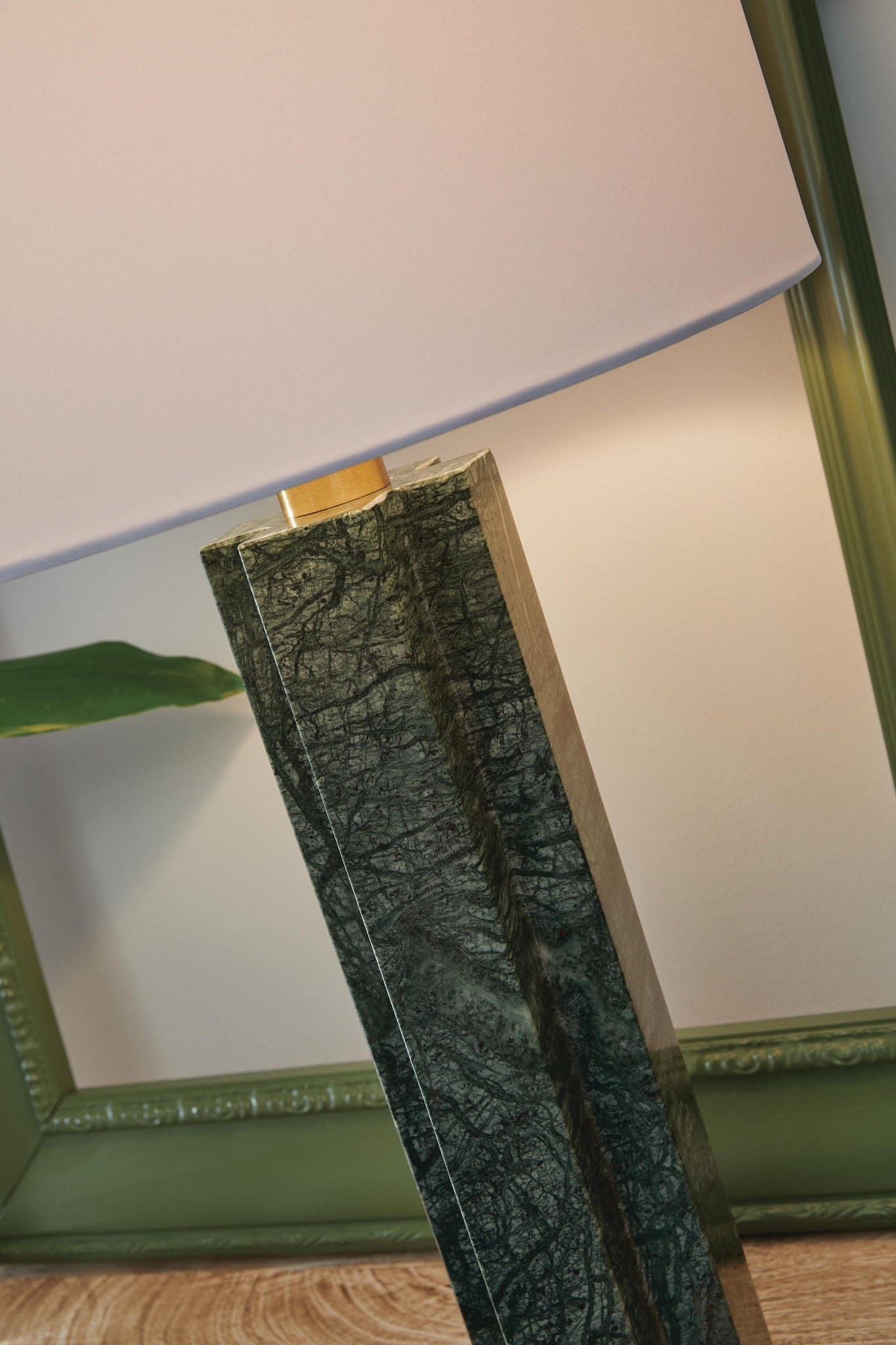 Green marble table lamp with white shade and tall rectangular stone base