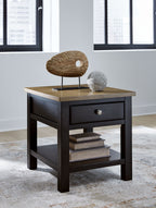 Brown rectangular end table with drawer and lower shelf, styled with small decor on top.