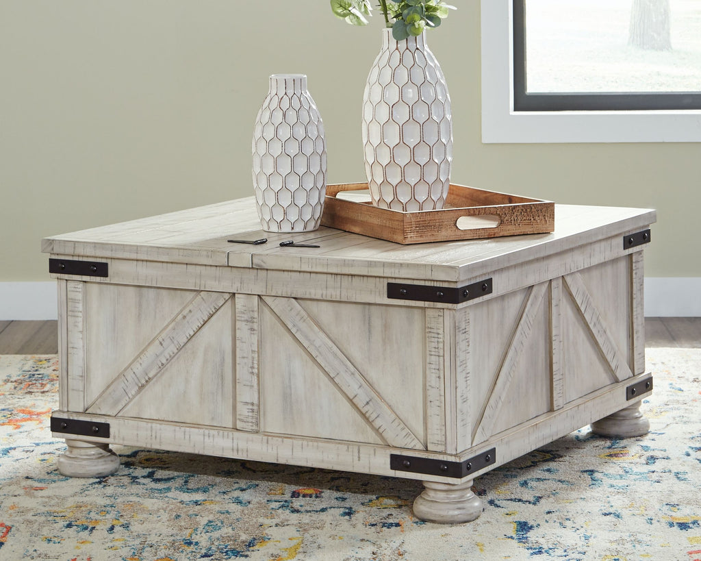 Whitewash cocktail table with storage, dark corner hardware and flat lift-top surface