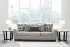 Gray living room sofa set with loveseat and matching armchairs and ottoman pieces