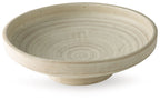 Antique beige ceramic bowl with shallow rim and speckled textured finish