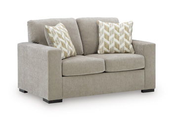Bridgepoint loveseat in light taupe fabric with two chevron-pattern throw pillows
