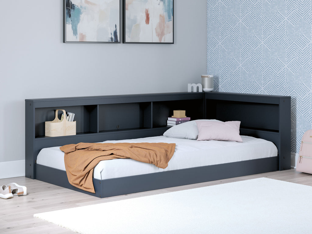 Blue bookcase storage bed with white mattress and pillow, built-in shelving