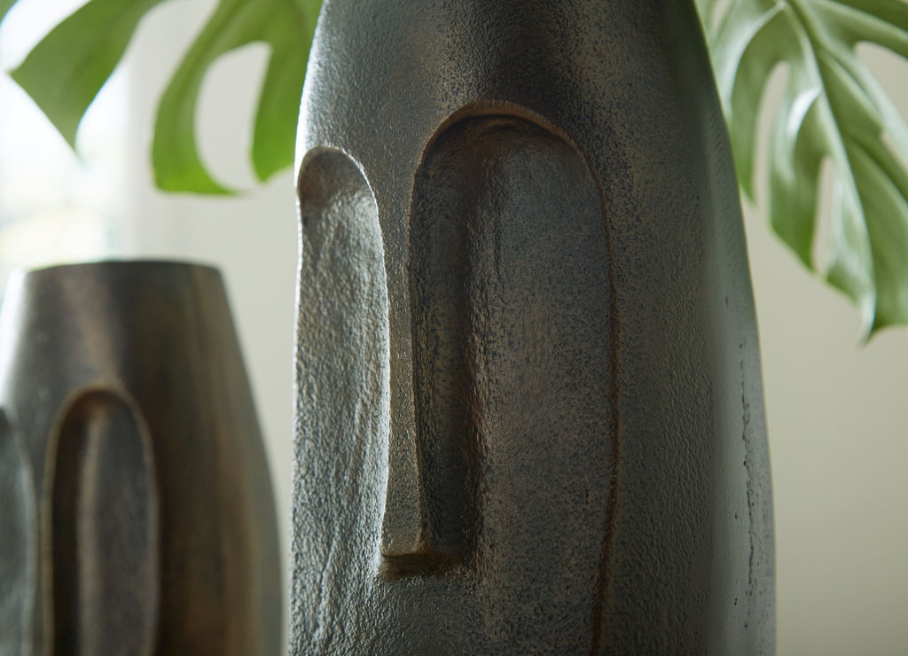 Bronze textured vase with vertical arched cutout, close-up side view