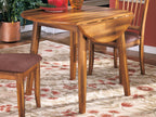 Round rustic brown drop-leaf table with hinged leaf section on tabletop