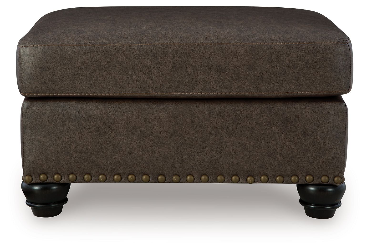 Dark brown upholstered ottoman with nailhead trim and rounded top with legs