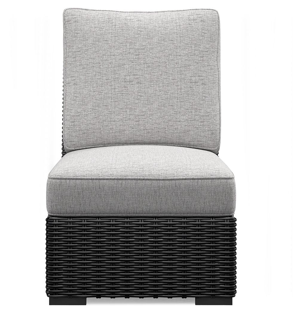 Light gray armless chair cushion set on black woven wicker base