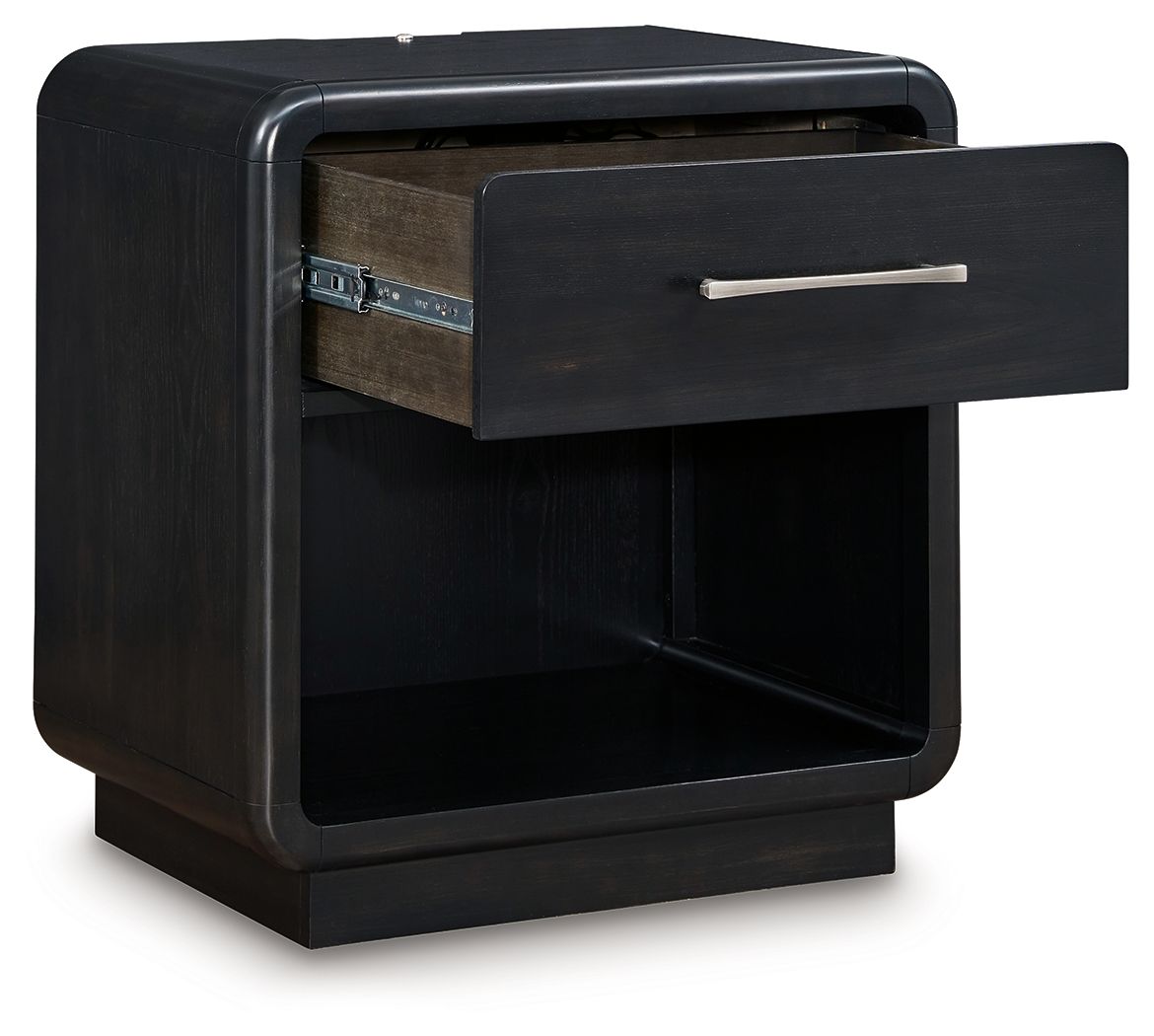 Rowanbeck black night stand with one drawer pulled open and bar pull, open shelf