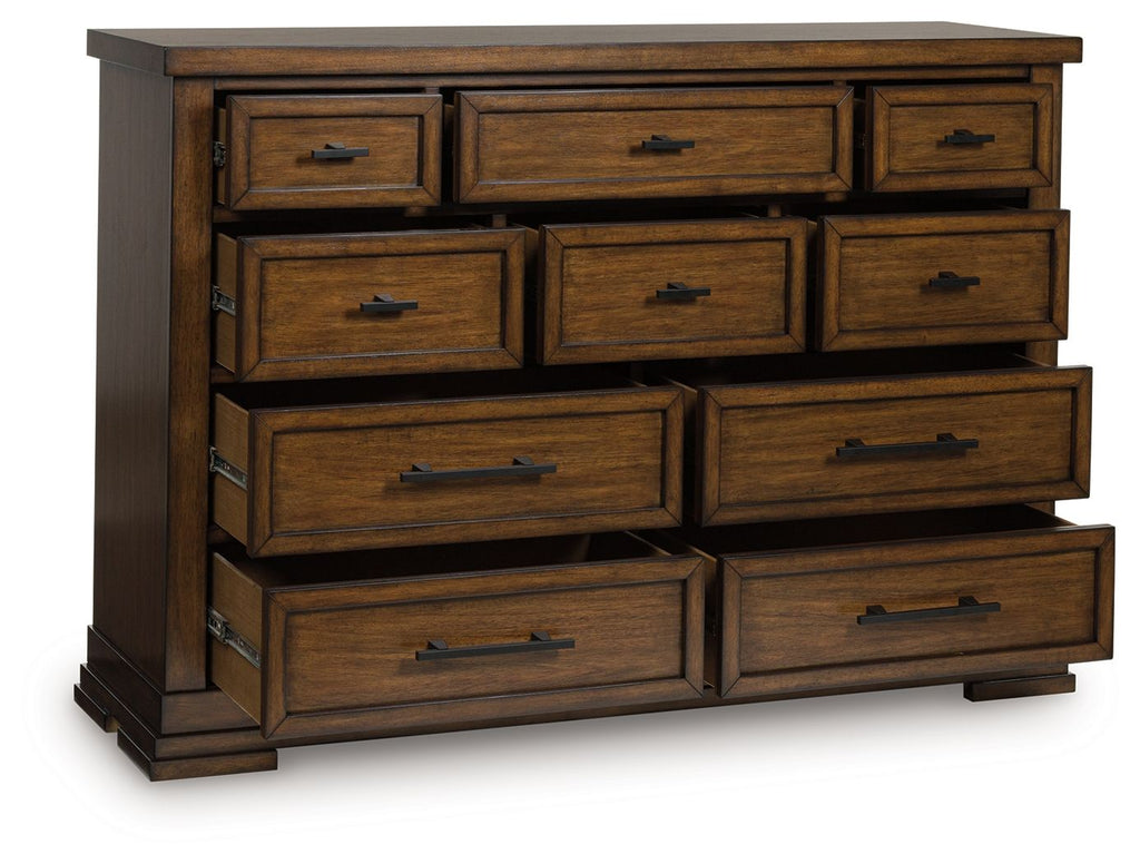 Medium brown wooden dresser with 9 drawers and black pulls, angled front