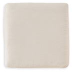 Cream upholstered accent ottoman with square seat and smooth fabric sides