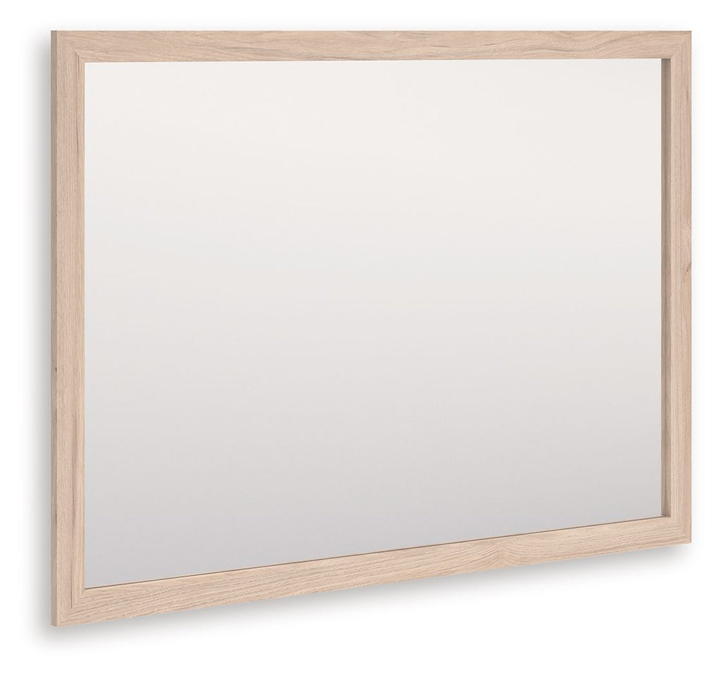 Tan wood-framed rectangular bedroom mirror, angled view with clear glass