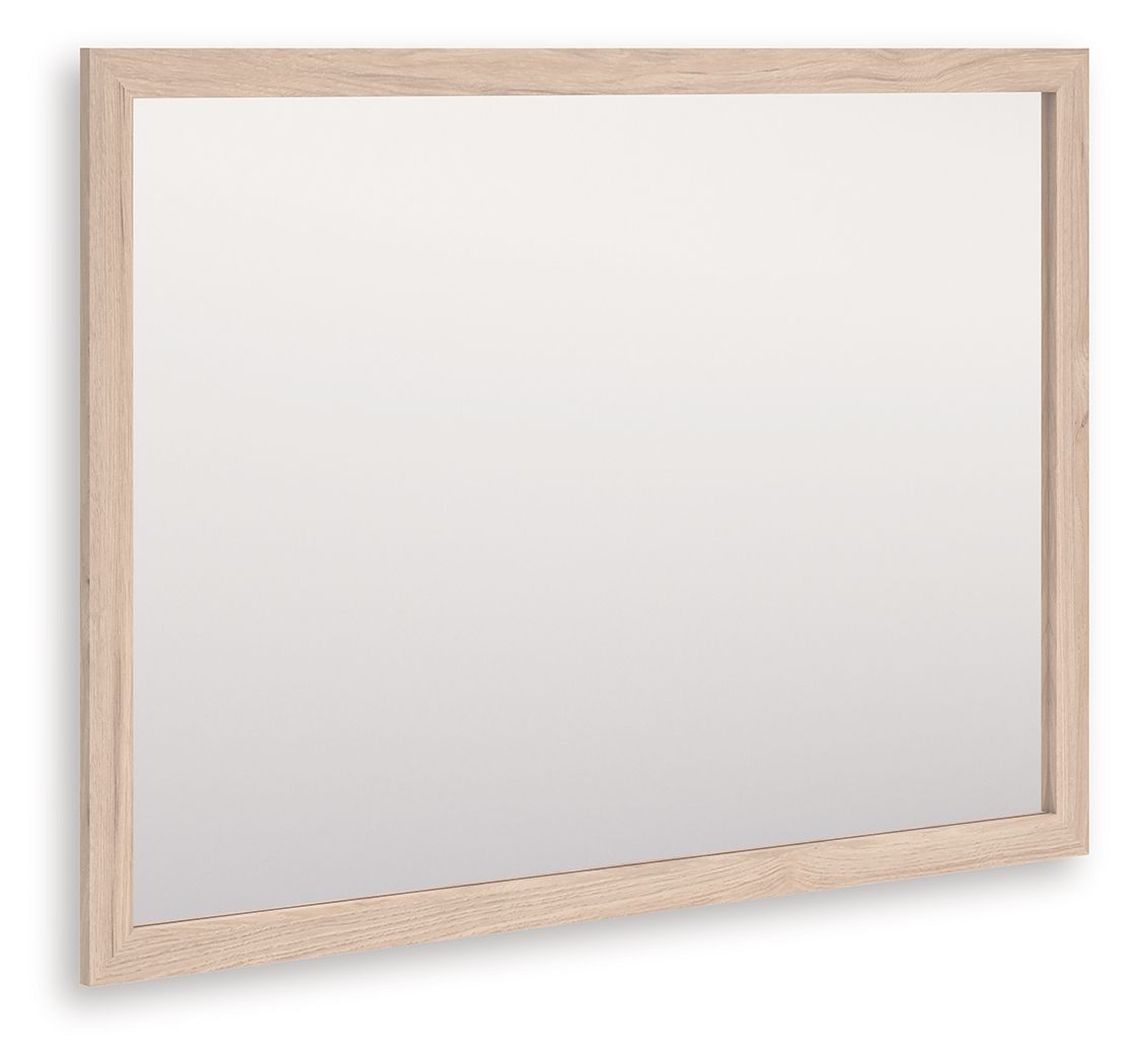 Tan wood-framed rectangular bedroom mirror, angled view with clear glass