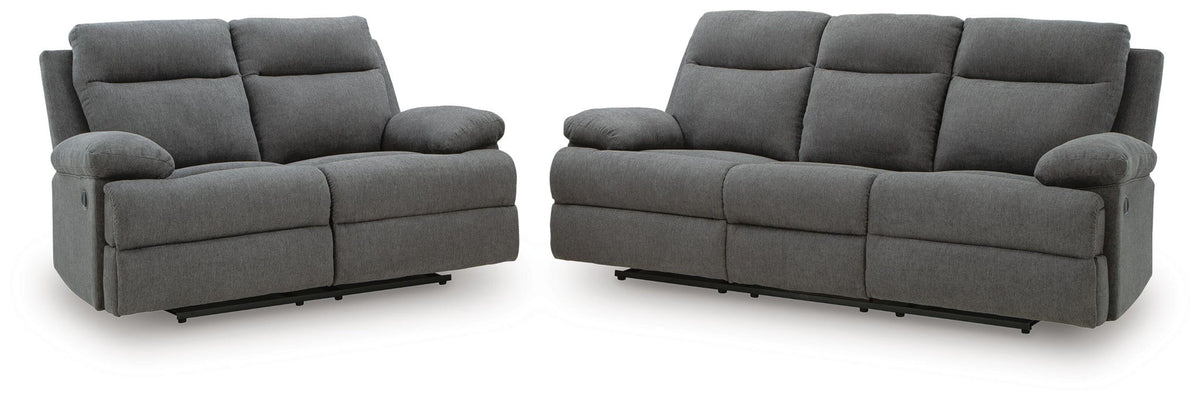 Reclining dark gray sofa and loveseat with padded arms and split back cushions