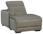 Gray upholstered reclining back chaise chair with stitched cushions and armrest