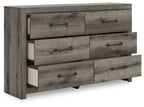 Six-drawer dresser with gray-brown wood finish and black bar pulls, drawers partially open