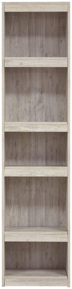 Whitewash wood bookcase with four open compartments and shelves