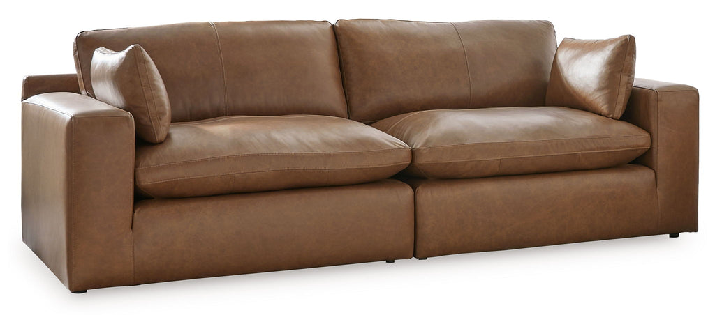 Caramel-brown sectional loveseat with chaise-style seat and rolled arms
