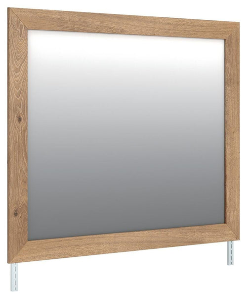 Brozmont bedroom mirror with tan wood frame