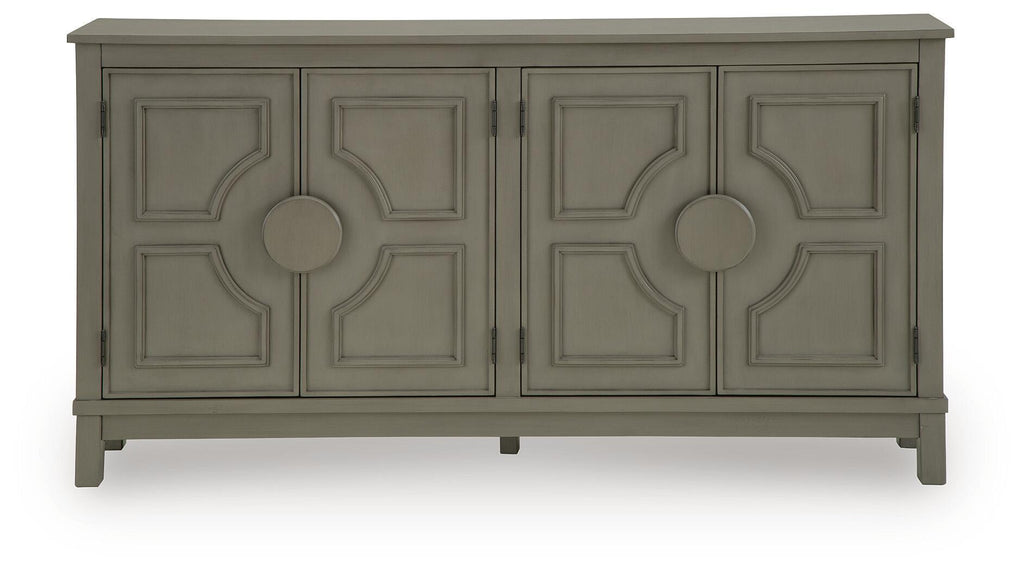Warm gray accent cabinet front with four paneled doors and circular knob hardware