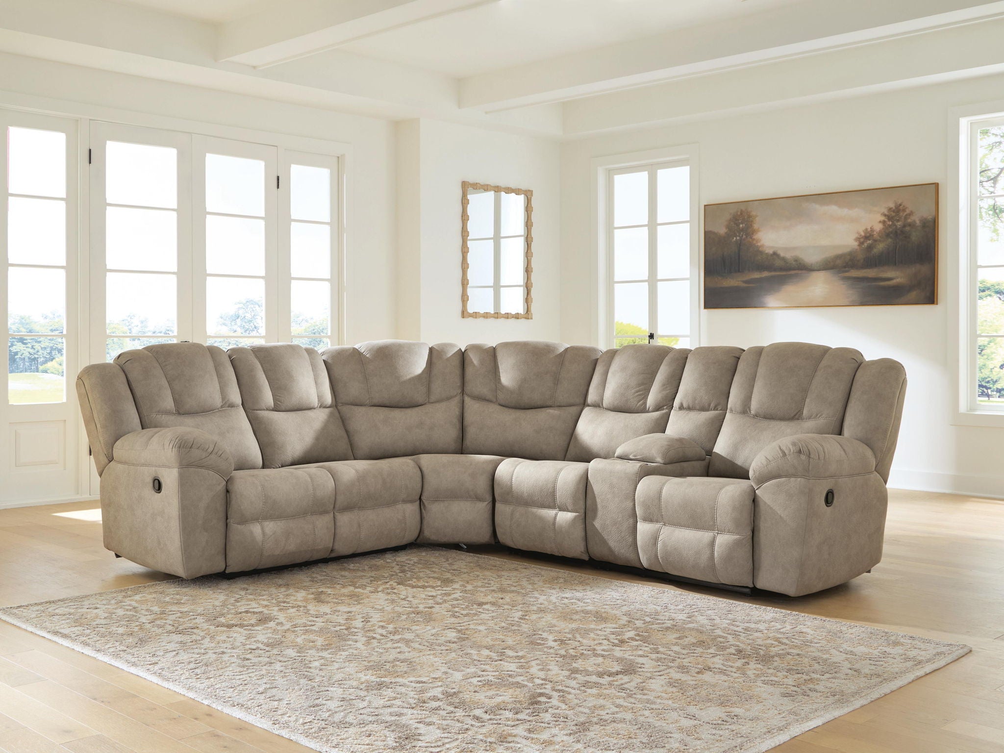 Birch recliner sectional sofa in a corner configuration with tufted back cushions