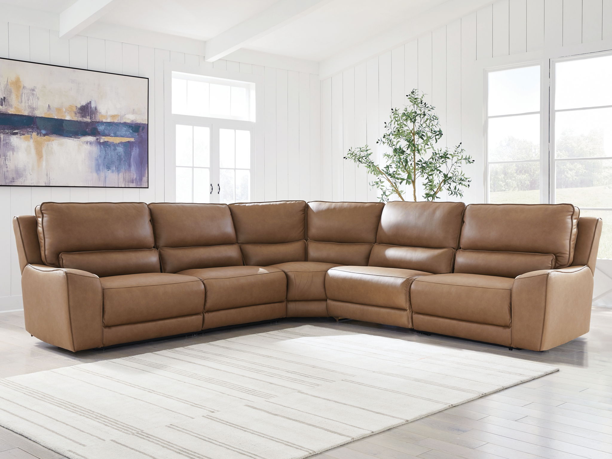 Power reclining sectional with corner chaise and smooth armrests in tan-brown leather